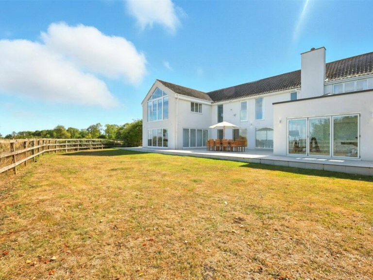 Rear of new build property with garden and terrace