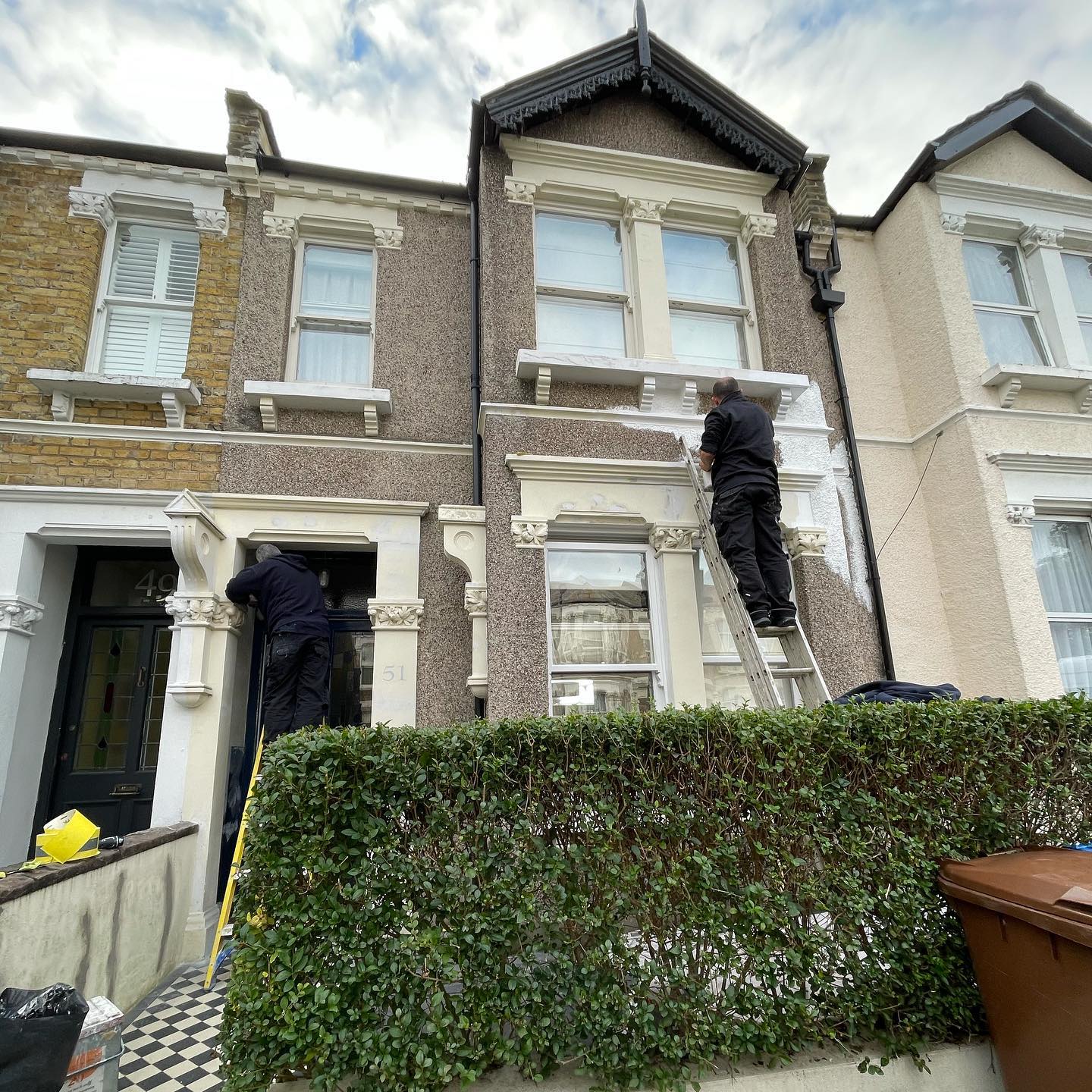 ABG Builders team painting a London terrace exterior