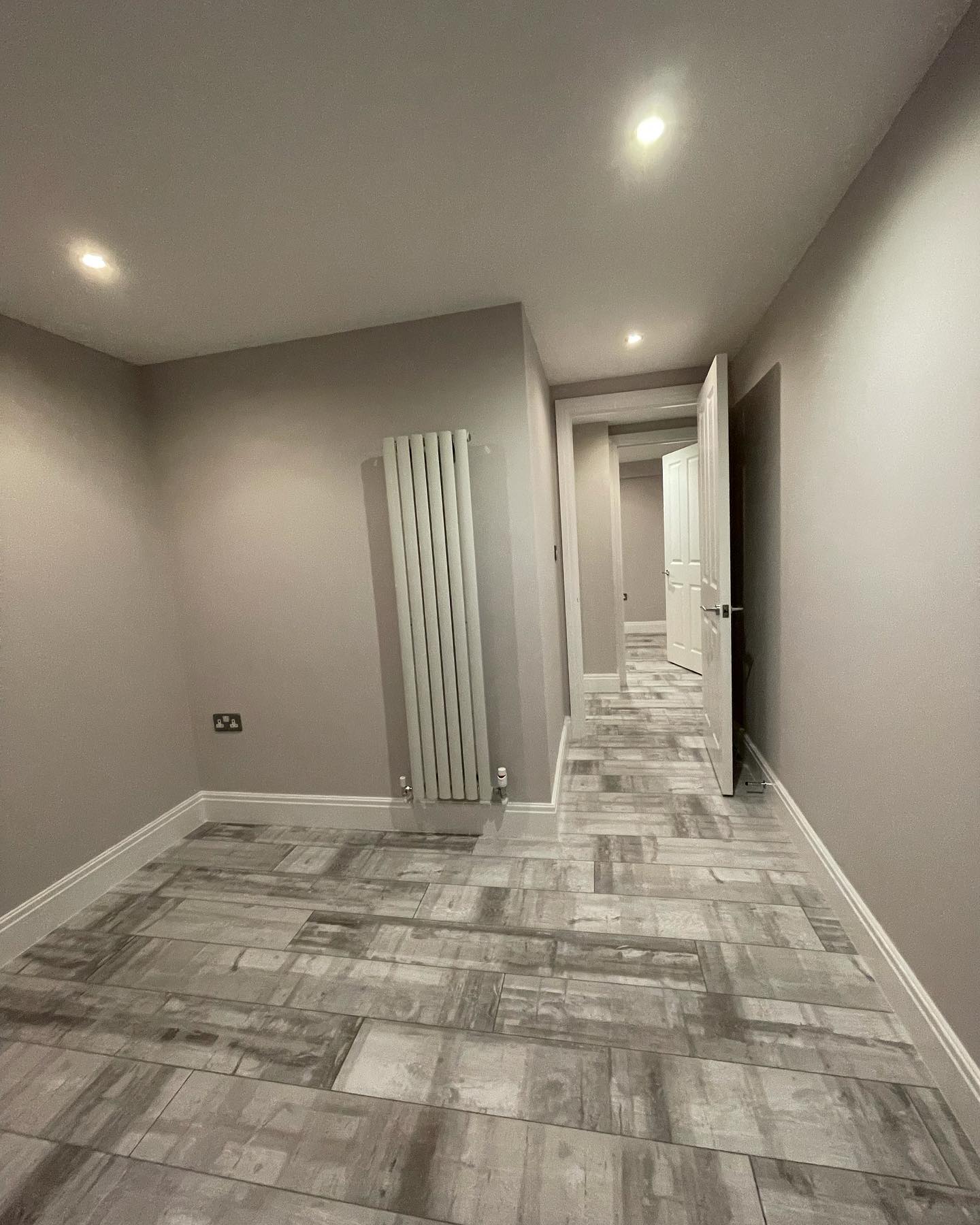 Freshly refurbished room with grey tile flooring